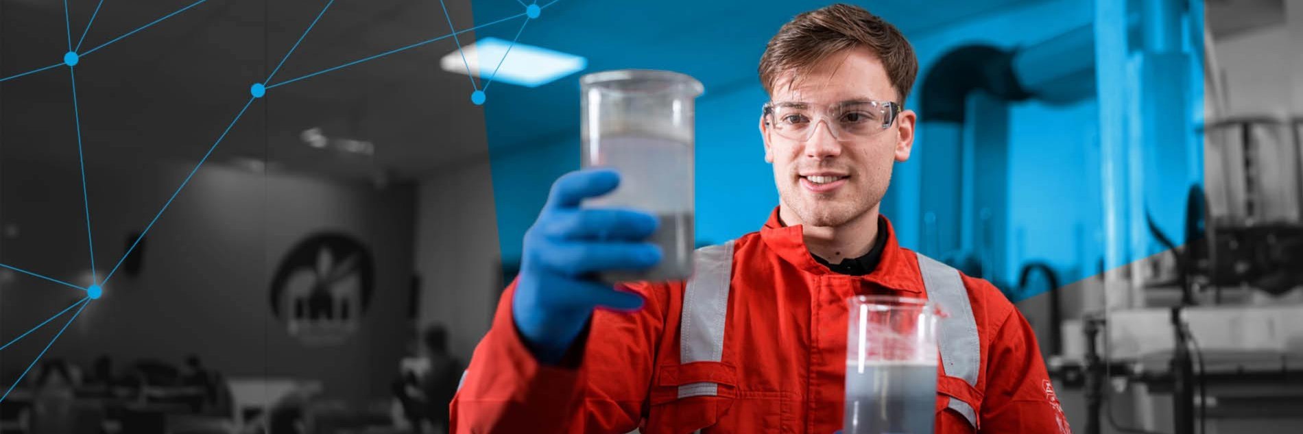 r&d scientist holding a cup filled with liquid