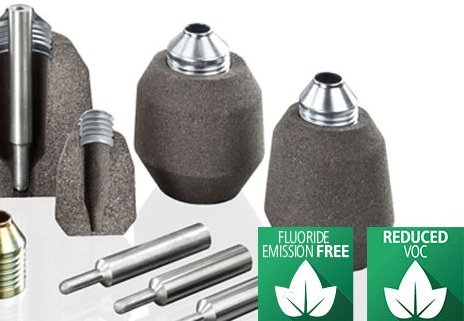 Assortment of Foseco foundry feeder sleeves and pins with labels indicating fluoride emission-free and reduced VOC properties.