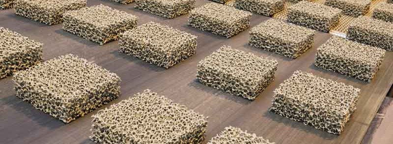 An array of ceramic foam filters on a production line, ready for use in steel casting processes