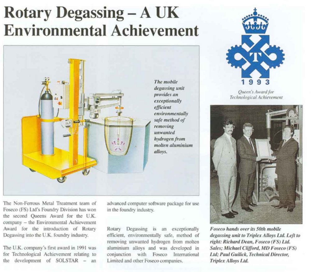 Highlighting a Technological Triumph in Rotary Degassing An article featuring a rotary degassing unit, awarded for its environmental benefits in metal treatment, alongside a group of professionals receiving the Queen's Award for Technological Achievement in 1993.