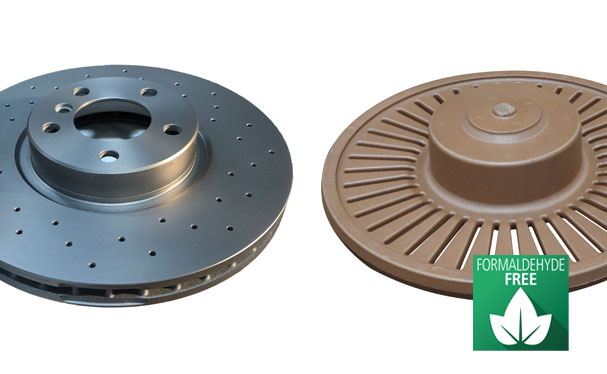 Two break disks, one metallic with perforations, and the associated core with a brown coating labeled as formaldehyde-free.